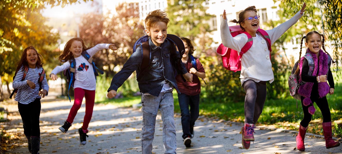 Group of elementary school kids running