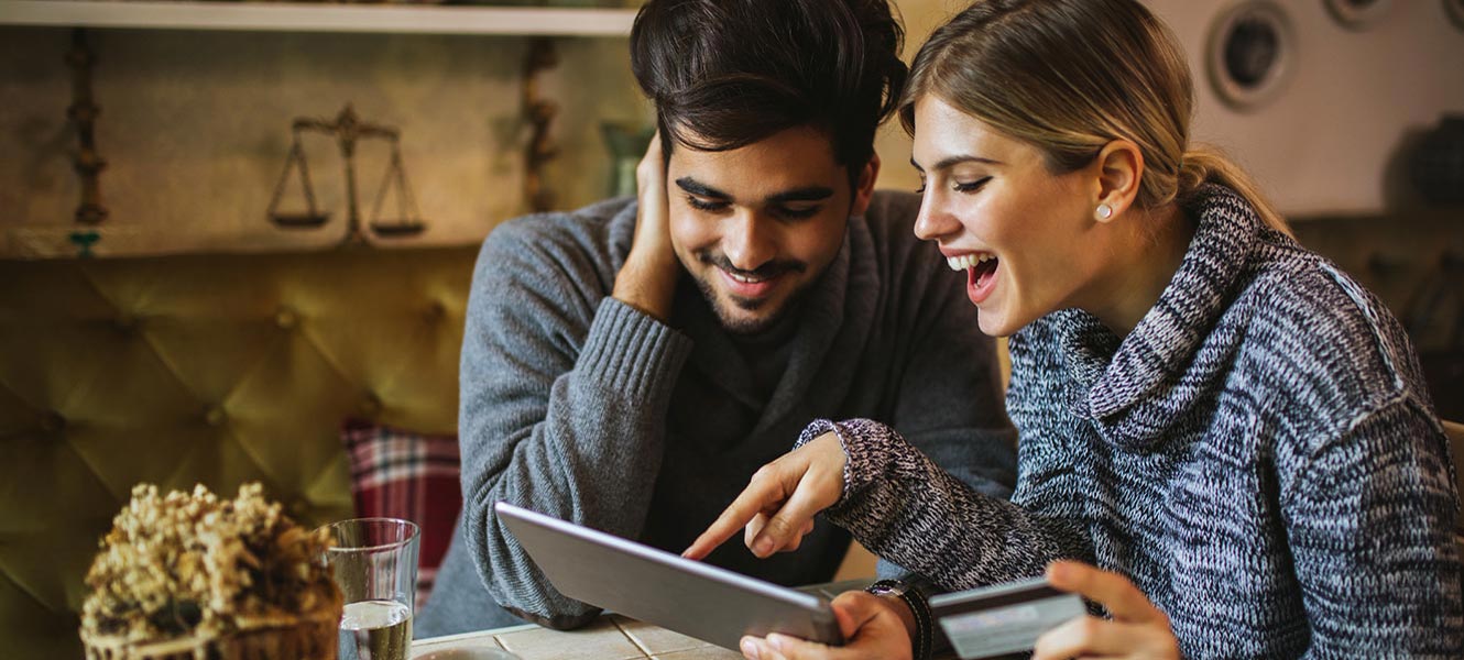 Young couple shopping on tablet