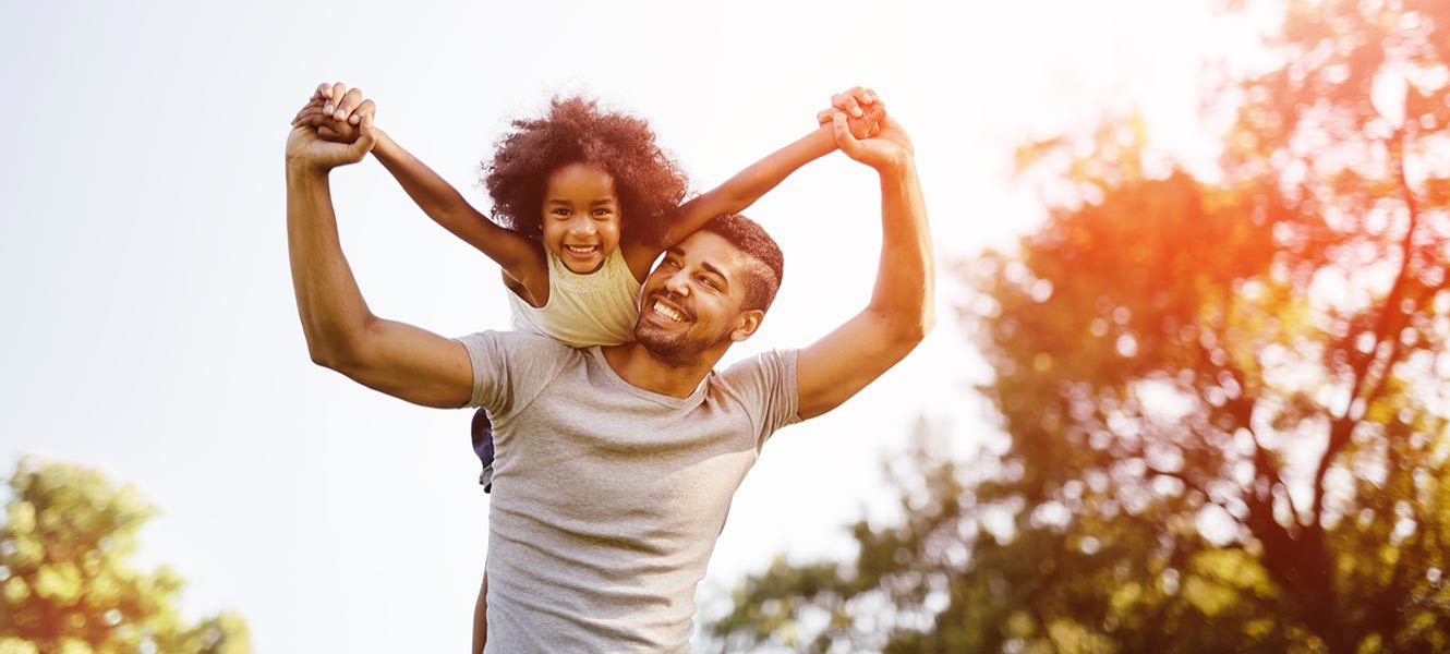 Father and daughter playing outside