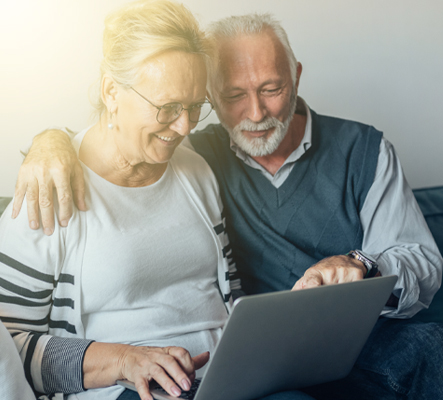 mature couple on laptop