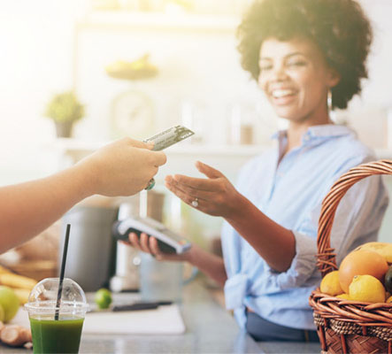 juice purchase with card will woman smiles with card machine