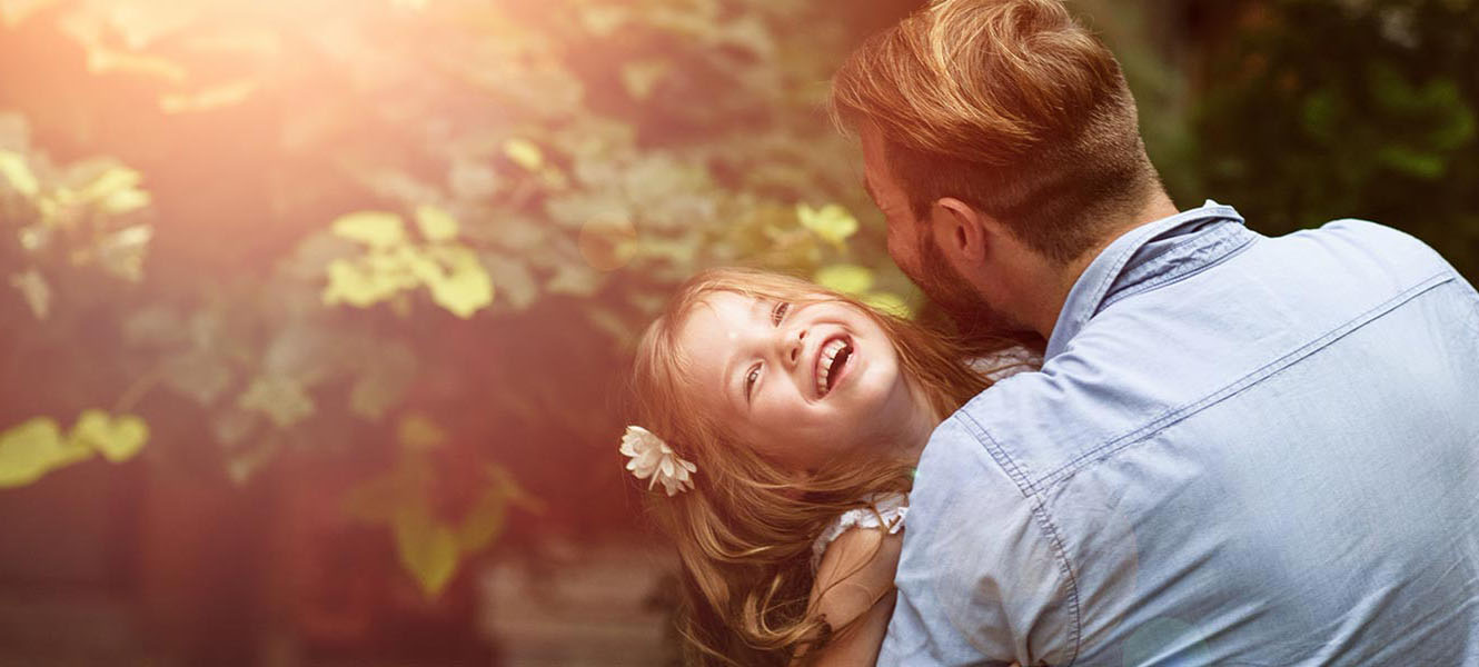 Father and daughter playing outside